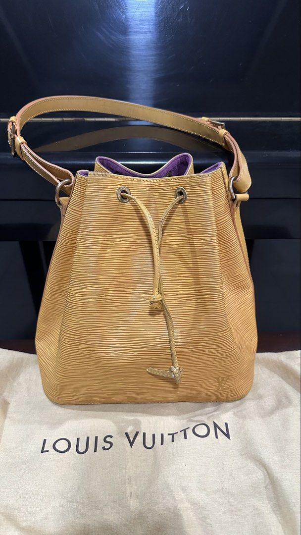 Authentic Louis Vuitton LV Epi Noe Petit (Category: Luxury Bags & Wallets) located in Las Pinas. Submitted by marshmallowmax (Listing ID 1459325218, Image 1). Description: Has minimal cracks on strings and strap handle leather on the datecode refer last 2 photos but still durable. With dustbag.