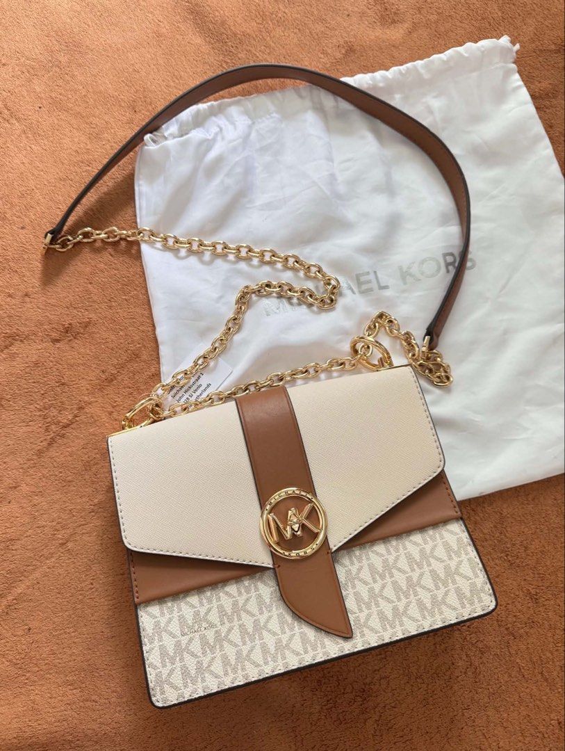 Authentic Michael Kors sling bag (Category: Cross-body Bags) located in Pasig City. Submitted by urbanstyle11 (Listing ID 1459303464, Image 1). Description: Brandnew Authentic Michael Kors bought in Milan, Italy note: no paper bag PM if interested.