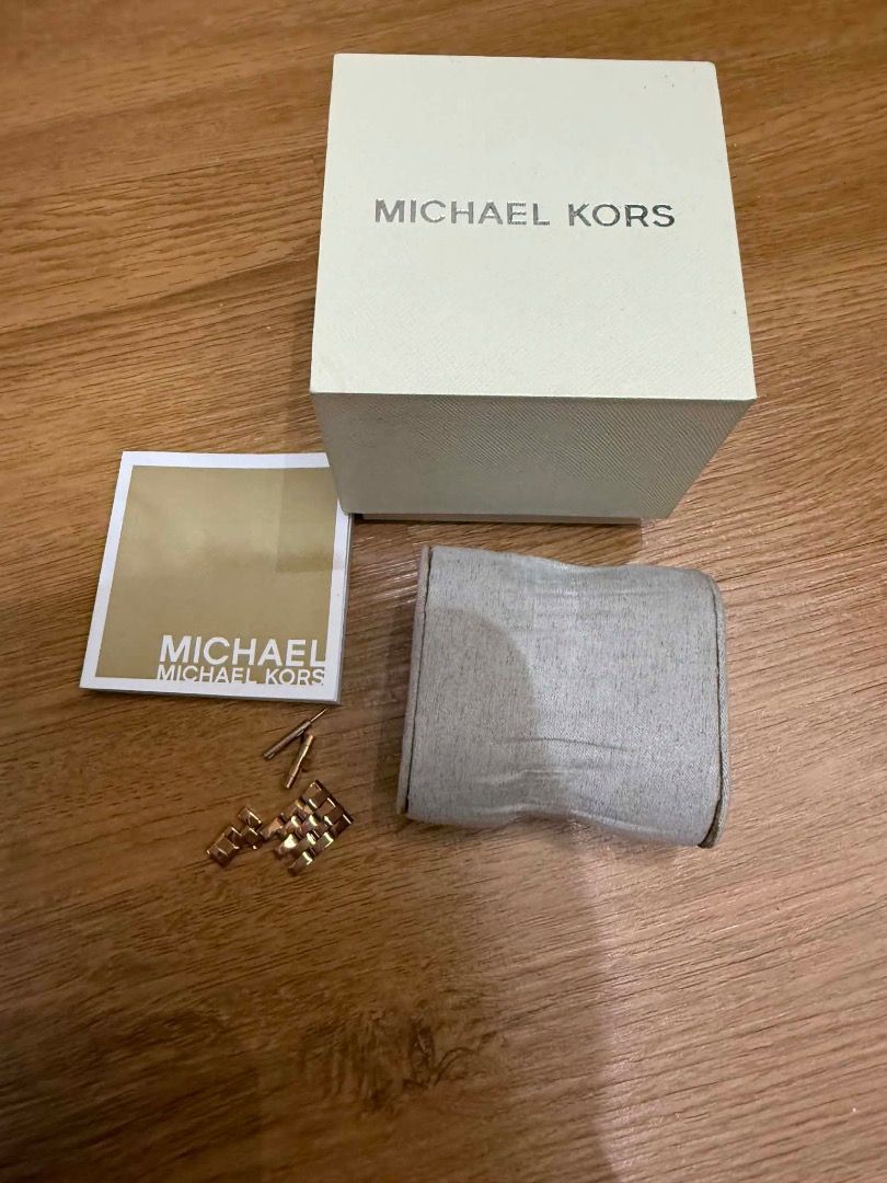 Authentic Michael Kors watch (Category: Luxury Accessories) located in Taguig. Submitted by discountedpcs (Listing ID 1459375733, Image 2). Description: - Authentic Michael Kors watch - Elegant rose gold color - Rose gold dial with subtle hour markers - Bezel encrusted with sparkling stones - Comes with original Michael Kors box and manual - Includes extra links for size adjustment - Excellent pre-loved condition - 15-16cm wrist Rfs: decluttering