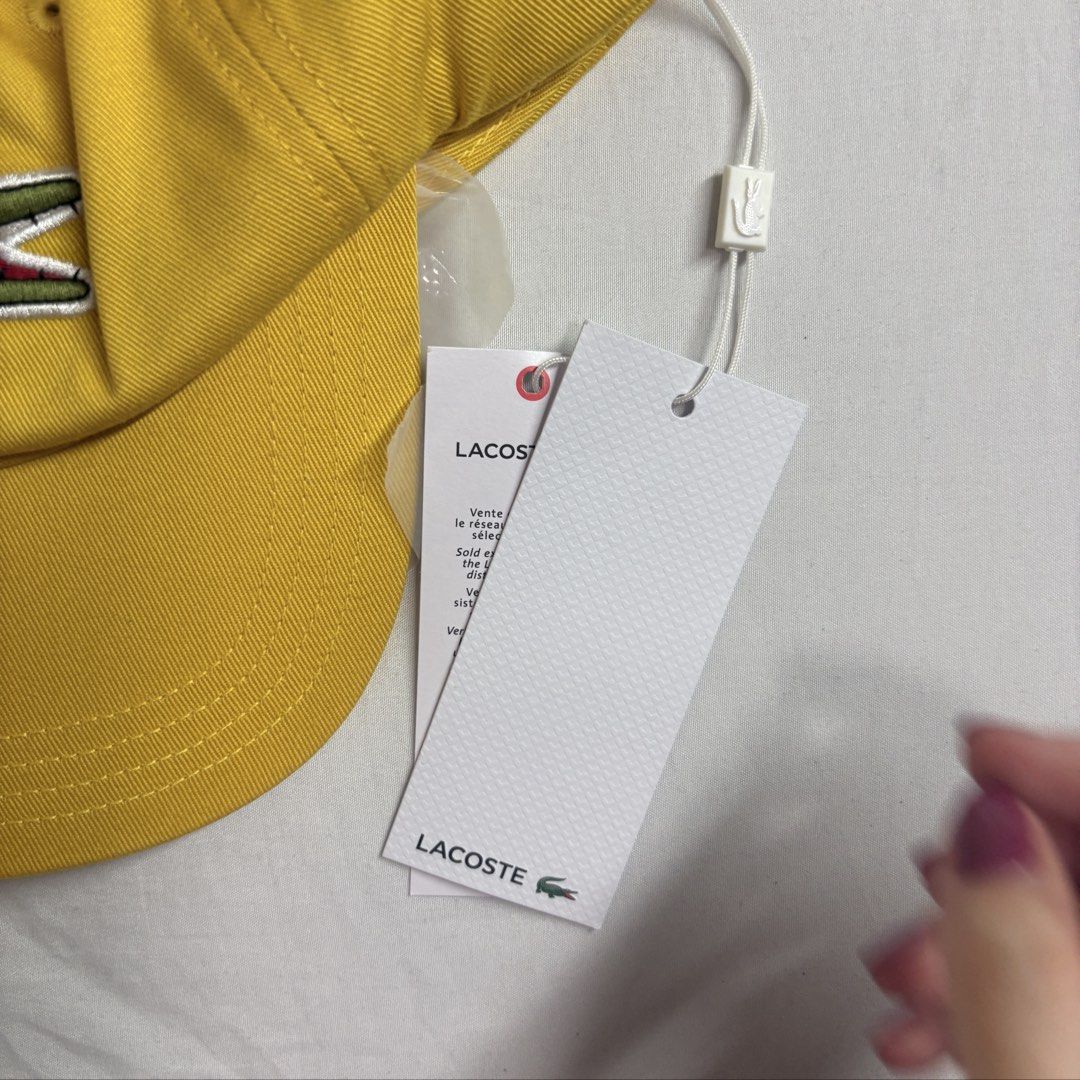 Authentic Unisex Lacoste Yellow Cap with Crocodile Logo (Category: Caps & Hats) located in Angeles City. Submitted by muse_archive (Listing ID 1459380458, Image 3). Description: - Authentic! -Unisex - One size fits most -With tag and packaging Original price 3,600 Selling it for 3,000 •Fixed price na po. Brand new po •Super steal! •Bought in the store (USA) .