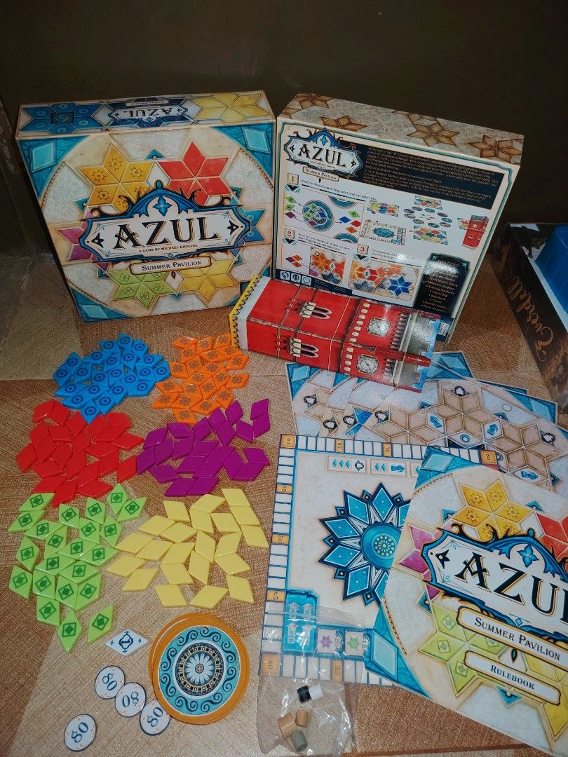 Azul Summer Pavilion Board Game (Category: Board Games & Puzzles) located in Santiago. Submitted by aceheart0118672 (Listing ID 1459293363, Image 1). Description: - Azul Summer Pavilion board game - not Complete set: 1 missing Orange tiles Includes player boards, score tower, and rulebook - All components shown in photos - Box included - Great strategy game for game nights.