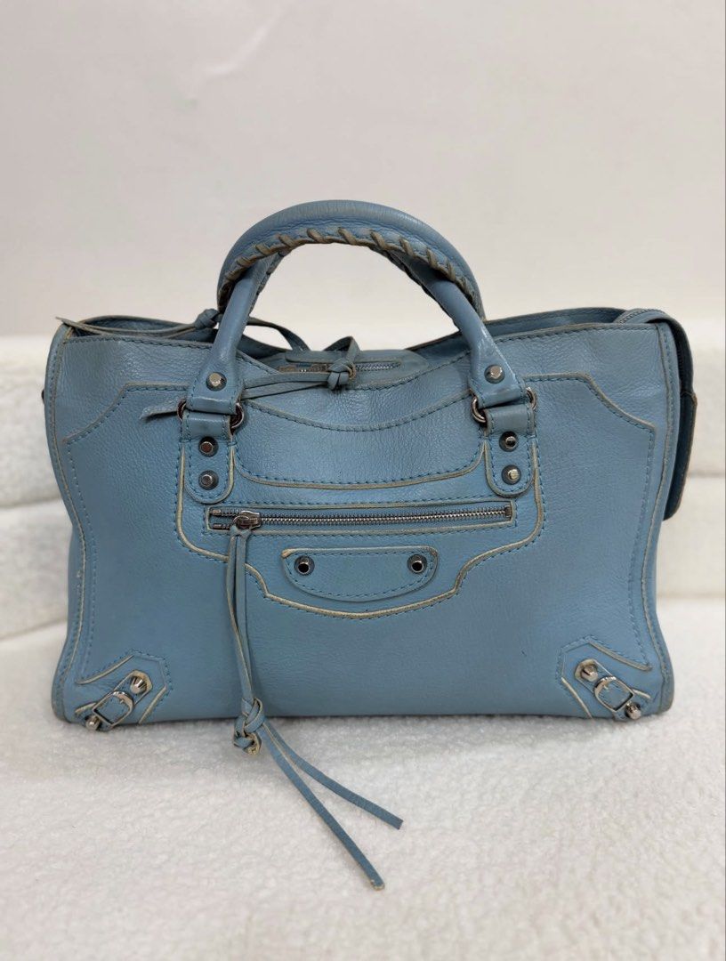 Balen City (Category: Luxury Bags & Wallets) located in Cavite. Submitted by beaucollective (Listing ID 1459359478, Image 1). Description: Balenciaga City —comes with dustbag, strap & mirror —8/10 condition.