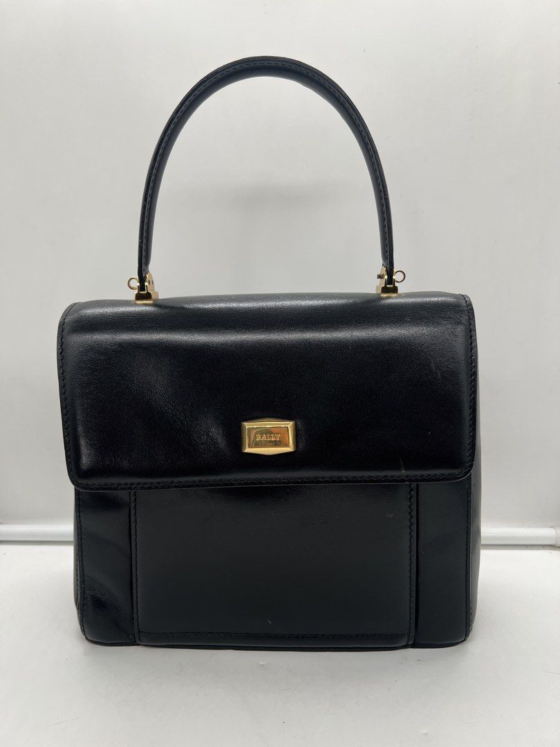 Bally vintage smooth black leather top-handle handbag (Category: Purses & Pouches) located in Cavite. Submitted by aellavier (Listing ID 1459339213, Image 1). Description: orig preloved vintage auth. minimal signs of use at the leather inside (may light scratches di gaano halata) excellent condition for a vintage bag.