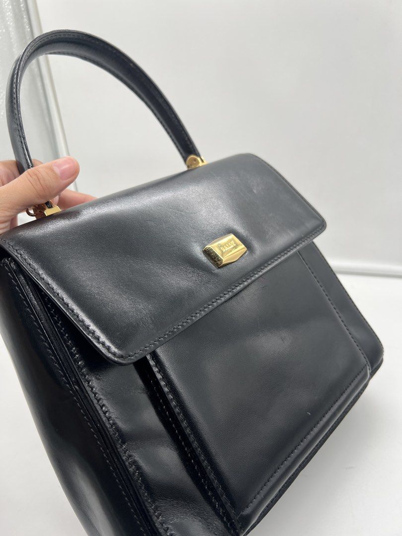 Bally vintage smooth black leather top-handle handbag (Category: Purses & Pouches) located in Cavite. Submitted by aellavier (Listing ID 1459339213, Image 3). Description: orig preloved vintage auth. minimal signs of use at the leather inside (may light scratches di gaano halata) excellent condition for a vintage bag.