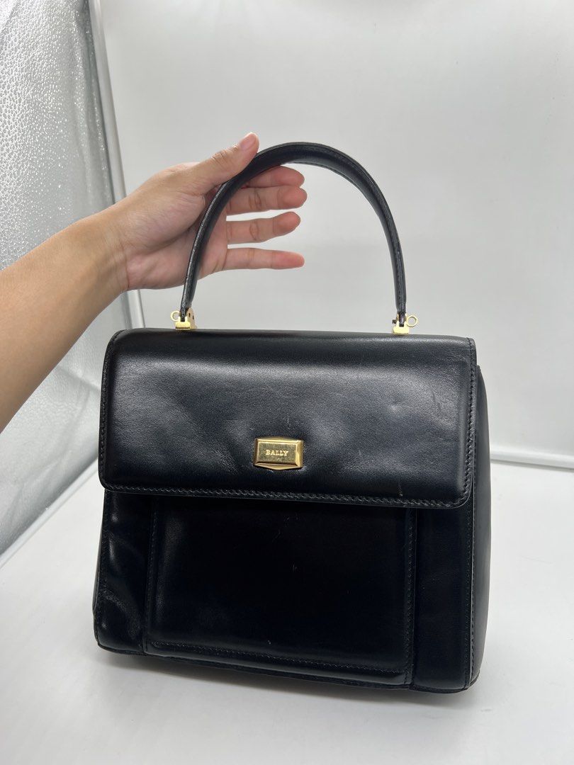 Bally vintage smooth black leather top-handle handbag (Category: Purses & Pouches) located in Cavite. Submitted by aellavier (Listing ID 1459339213, Image 2). Description: orig preloved vintage auth. minimal signs of use at the leather inside (may light scratches di gaano halata) excellent condition for a vintage bag.