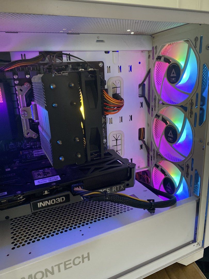 Basic gaming computer 3060TI GPU (Category: Desktops) located in Singapore. Submitted by ic3teh (Listing ID 1459360408, Image 2). Description: - White Montech PC Case (side panel accessible) - 5 RGB Fans - Geforce RTX 3060TI OC - AMD Ryzen5 5600 6 cores 12 threads - CORSAIR 32GB ram (white) Can play -blackmyth wukong at mid setting -Cs2 mid setting at 300fps Dota 2, fortnite etc Includes computer + cable. Just plug and play. Self collect .