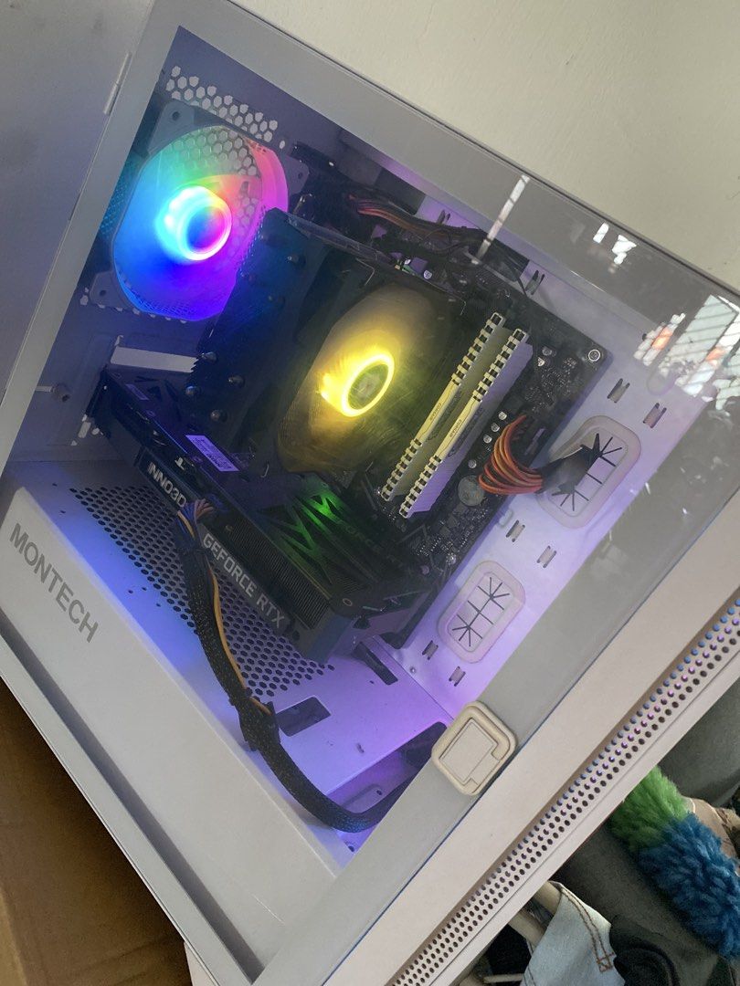Basic gaming computer 3060TI GPU (Category: Desktops) located in Singapore. Submitted by ic3teh (Listing ID 1459360408, Image 1). Description: - White Montech PC Case (side panel accessible) - 5 RGB Fans - Geforce RTX 3060TI OC - AMD Ryzen5 5600 6 cores 12 threads - CORSAIR 32GB ram (white) Can play -blackmyth wukong at mid setting -Cs2 mid setting at 300fps Dota 2, fortnite etc Includes computer + cable. Just plug and play. Self collect .