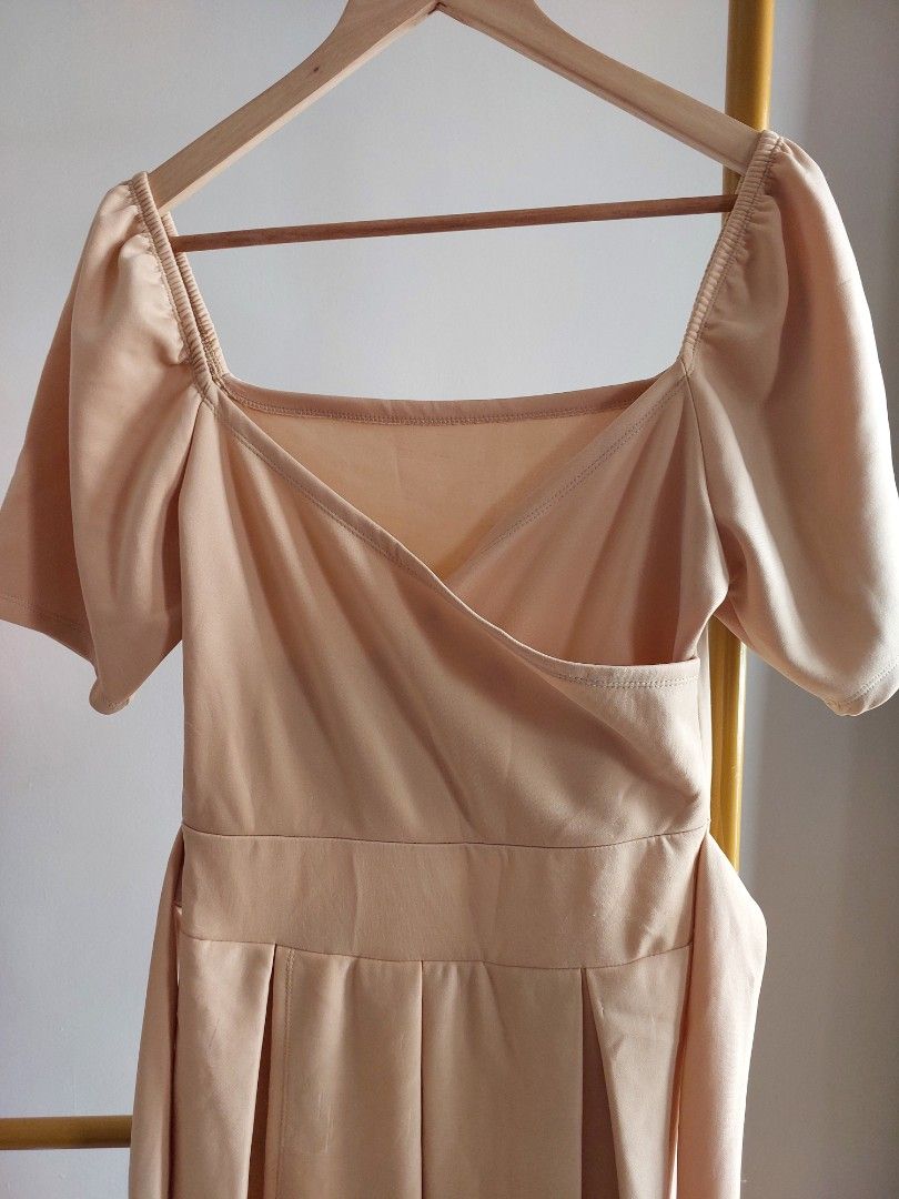 Beige Puff Sleeve Full Dress (Category: Dresses) located in Paranaque City. Submitted by ronaroselle17 (Listing ID 1459387382, Image 1). Description: - Light pink midi dress - Features elegant puff sleeves - Cinched waist with flattering pleats - Wrap-style bodice illusion - Ideal for special events or a nice dinner - Material has a subtle sheen.