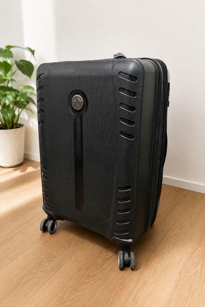 Medium Hard Shell Suitcase (Category: Luggage) located in Manila. Submitted by esalandic14384 (Listing ID 1459325828, Image 1). Description: Preloved Barry Smith black hard-shell luggage, originally bought in Malaysia. Spacious and still very functional, with four spinner wheels for easier movement. Condition: Well used, with visible scratches and scuff marks from travel, as shown in the photos. Please note: The telescopic pull-up handle sometime