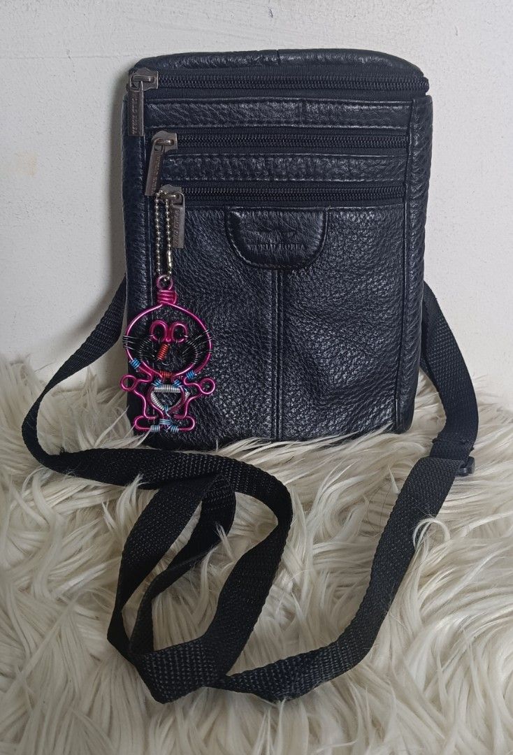Black Leather Sling Bag (Category: Sling Bags) located in Davao. Submitted by roxy0404 (Listing ID 1459446561, Image 1). Description: ukay source no issue size : length 5 inches height 8 inches width 1 inch.
