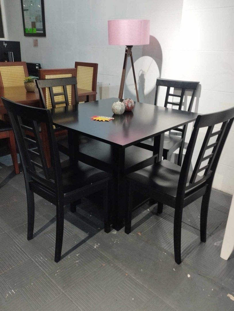 Black Square Dining Table with 4 Chairs (Category: Tables & Sets) located in Makati City. Submitted by kdclueless (Listing ID 1459378116, Image 1). Description: - Black square dining table - Includes 4 matching chairs with slatted back design - Ideal for small spaces and apartments - Modern, minimalist aesthetic - Ready for its new home!.
