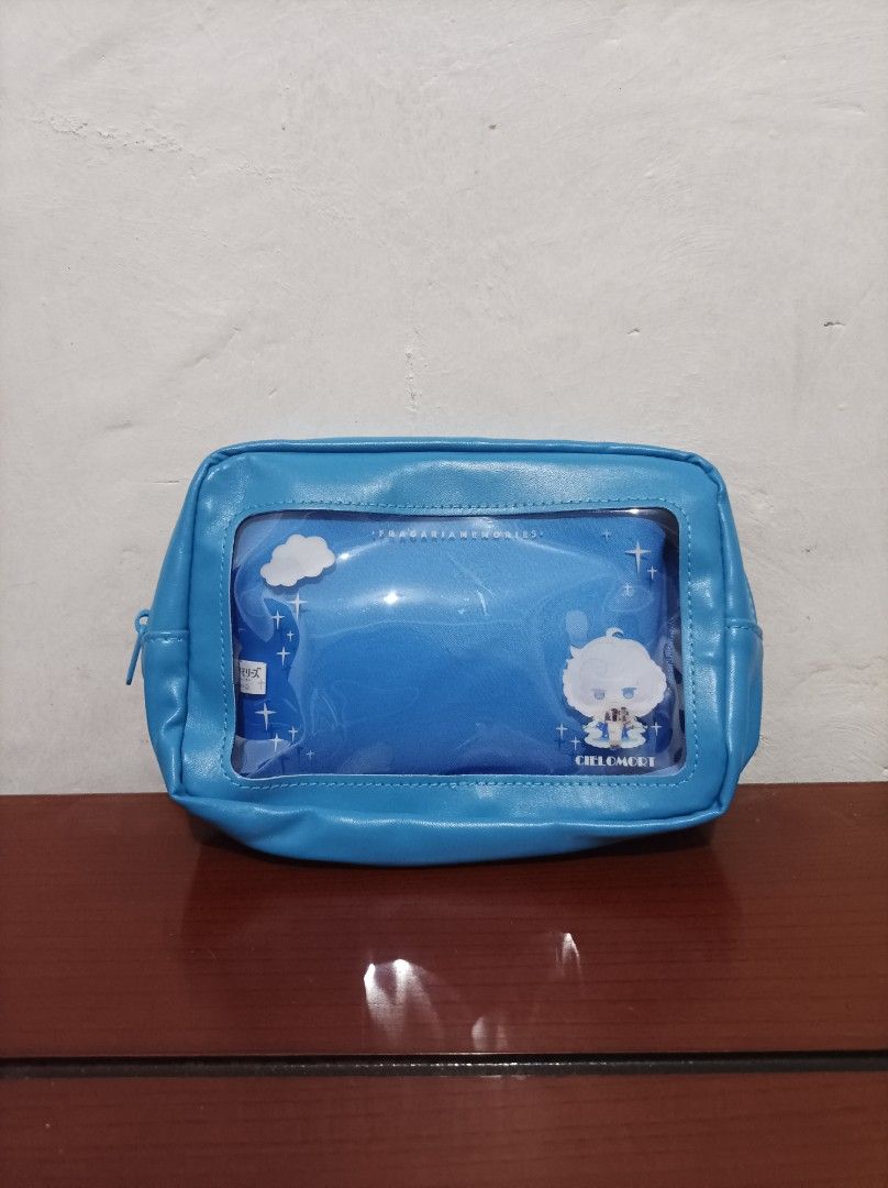 Blue Anime Character Pouch with Clear Window (Category: Purses & Pouches) located in Bacoor. Submitted by kuroochiii94695 (Listing ID 1459298319, Image 1). Description: - Adorable blue pouch with a clear window for easy viewing. - Features a cute anime character design and charming cloud accents. - Interior boasts a fun starry pattern. - Secure zipper closure to keep your items safe. - Ideal for organizing small essentials like stationery, makeup