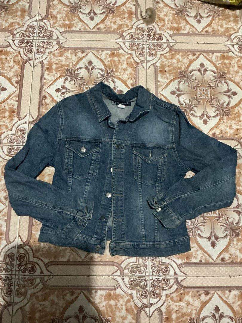 Blue Denim Jacket (Category: Coats, Jackets and Outerwear) located in Santa Barbara. Submitted by user82739292 (Listing ID 1459404822, Image 2). Description: - Classic blue denim jacket - Button-up front - Two chest pockets - Long sleeves with button cuffs - Standard fit - Great for layering - Easy to style.