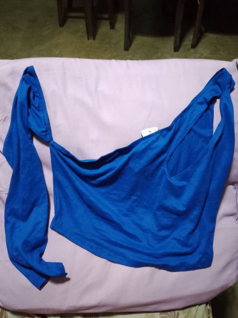 Blue One Shoulder Cut Out Crop Top (Category: Sleeveless) located in Batangas. Submitted by sheenx.09 (Listing ID 1459317027, Image 2). Description: - 2XL on tag (XL to 2xl) - Trendy blue one-shoulder crop top 😃 - Features a stylish front cutout - One long sleeve design - Made from stretchy material for a comfortable fit 😁 - Versatile for night outs or casual styling ♥️.