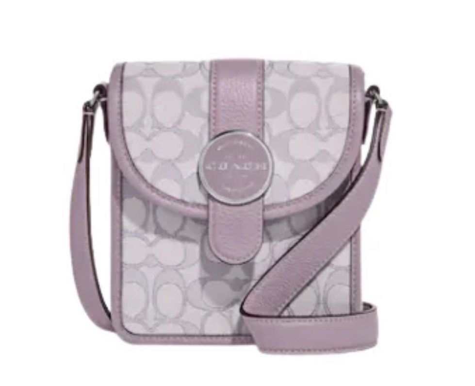 Body bag (Category: Cross-body Bags) located in Pototan. Submitted by tres_190725 (Listing ID 1459461508, Image 1). Description: This is a Coach North/South Lonnie Crossbody Bag designed in a compact, vertical silhouette.Key Features & DesignMaterials: Crafted from a combination of Signature jacquard canvas and refined pebbled leather trim.Color Palette: Features a muted pastel lavender/soft lilac color scheme paired with a light off-white signat