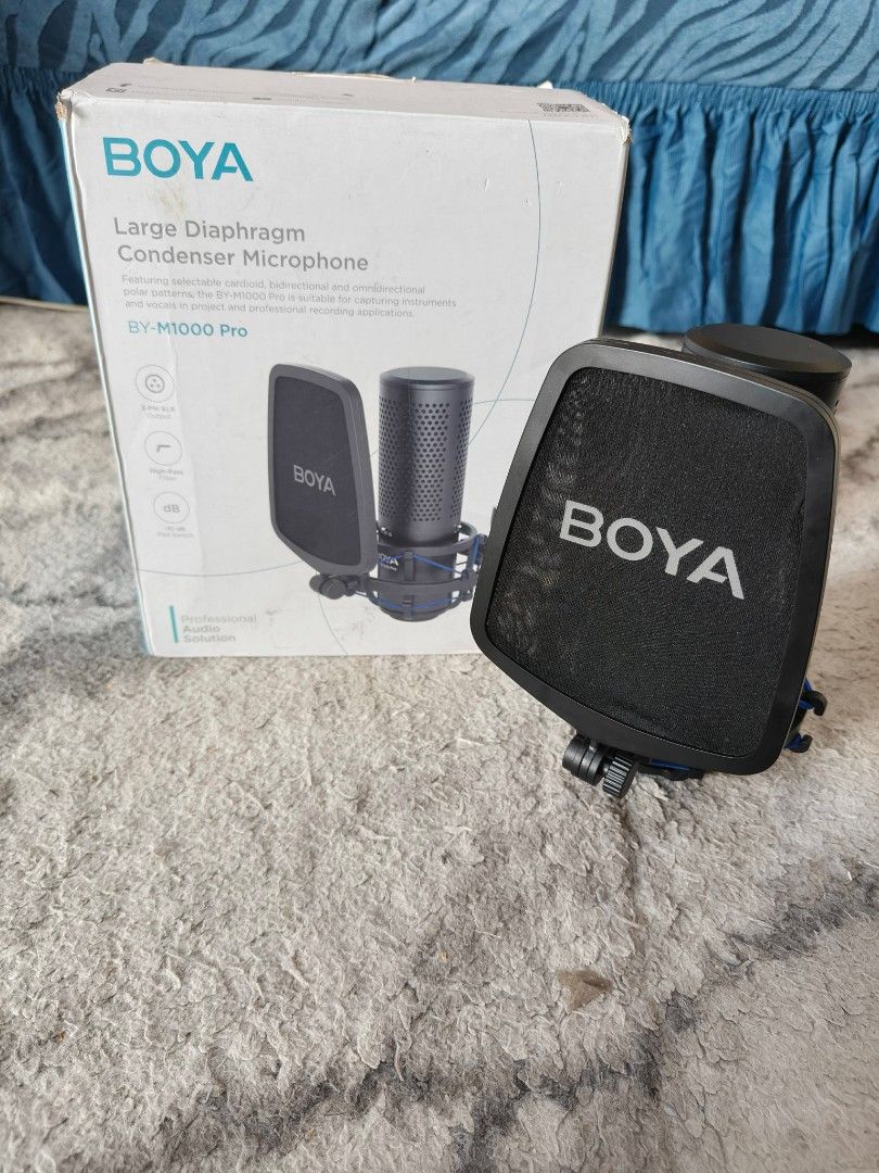 BOYA BY-M1000 Pro Large Diaphragm Condenser Microphone (Category: Microphones) located in Caloocan City. Submitted by tamonchi (Listing ID 1459487558, Image 1). Description: - BOYA BY-M1000 Pro Condenser Microphone - Large diaphragm for professional sound - Comes with pop filter and shock mount - Ideal for recording vocals and instruments - Complete professional recording solution - Original box included.
