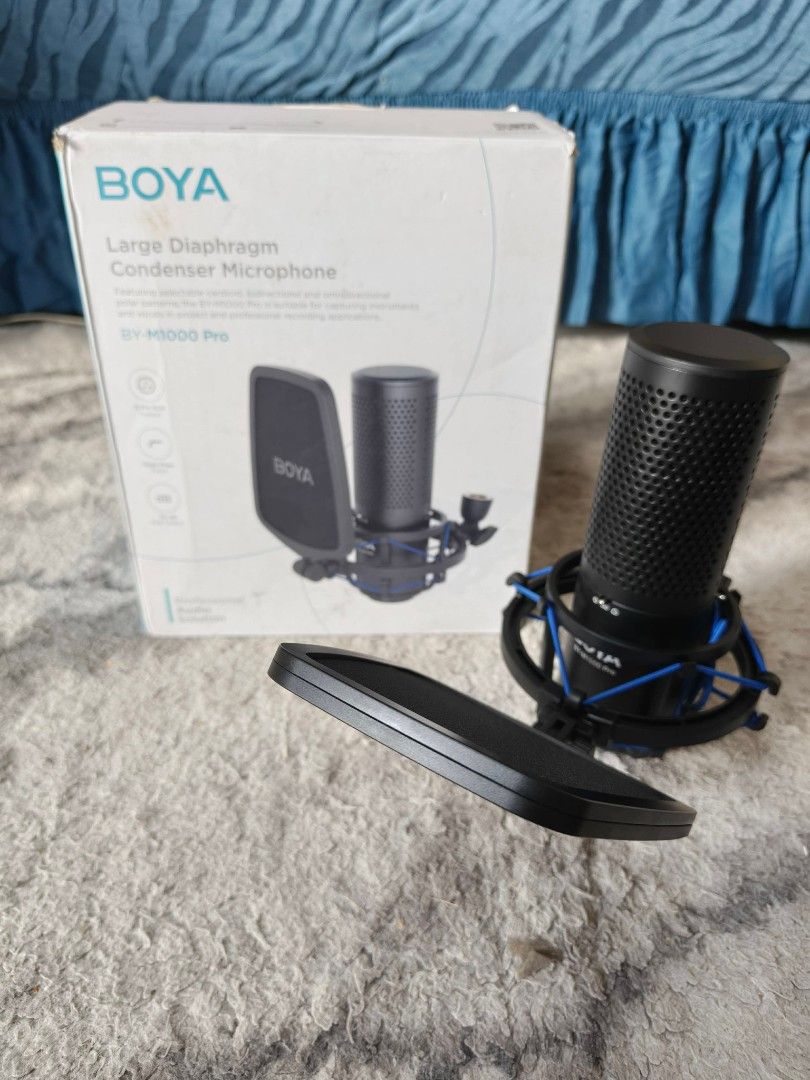 BOYA BY-M1000 Pro Large Diaphragm Condenser Microphone (Category: Microphones) located in Caloocan City. Submitted by tamonchi (Listing ID 1459487558, Image 2). Description: - BOYA BY-M1000 Pro Condenser Microphone - Large diaphragm for professional sound - Comes with pop filter and shock mount - Ideal for recording vocals and instruments - Complete professional recording solution - Original box included.