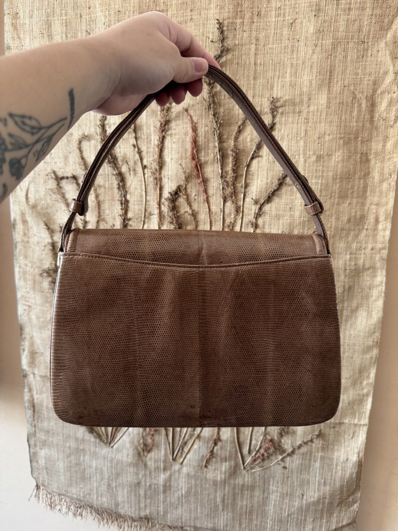 Brown Lizard-Embossed Shoulder Bag with Gold Clasp (Category: Luxury Bags & Wallets) located in Bacoor. Submitted by nicafindssince2022 (Listing ID 1459406710, Image 3). Description: - Brown shoulder bag with lizard-embossed texture - Classic flap closure with gold-tone metal clasp - Adjustable strap for comfortable wear - Structured shape with a vintage feel - Perfect for adding a sophisticated touch to any outfit - Approximate measurements: 10 