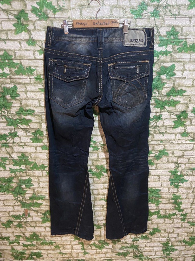 Buckaroo Original Vintage Jeans (Category: Jeans) located in Davao. Submitted by mengsmixitems (Listing ID 1459293582, Image 2). Description: - Original vintage Buckaroo jeans in dark wash. - Features a distressed look with contrast stitching. - Multiple pockets, some with zippers for added security. - Classic button fly closure. - Comfortable classic fit with a slight flare at the bottom. - Ideal for achieving a casual, rugged aesthetic. size 34