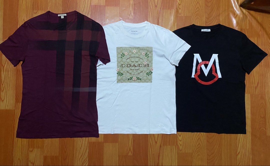 Burberry, Coach, Moncler T-Shirts Bundle (Category: Luxury Apparel) located in Cebu City. Submitted by monflor (Listing ID 1459432747, Image 1). Description: - Bundle of 3 designer t-shirts - Includes: Burgundy Burberry plaid tee, White Coach graphic tee, Black Moncler logo tee - All short-sleeved - Ideal for casual wear Size small to medium Good condition No issues Price each 745.