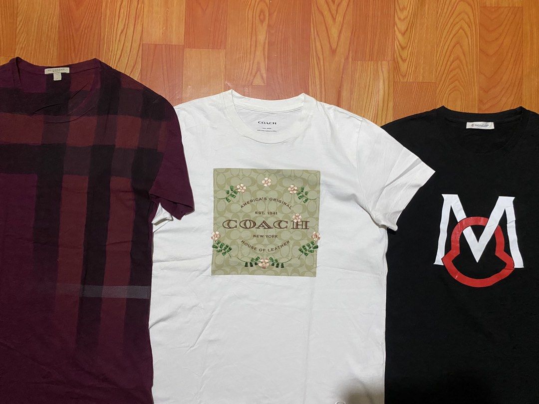 Burberry, Coach, Moncler T-Shirts Bundle (Category: Luxury Apparel) located in Cebu City. Submitted by monflor (Listing ID 1459432747, Image 2). Description: - Bundle of 3 designer t-shirts - Includes: Burgundy Burberry plaid tee, White Coach graphic tee, Black Moncler logo tee - All short-sleeved - Ideal for casual wear Size small to medium Good condition No issues Price each 745.