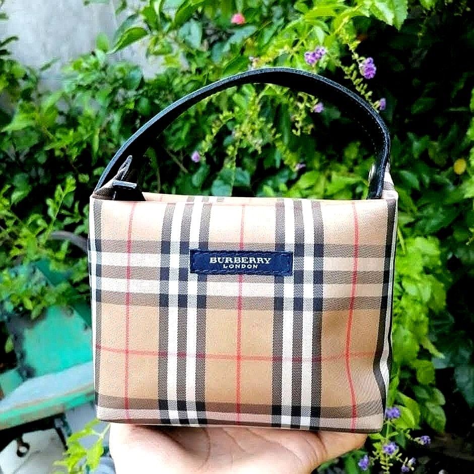 Burberry London Nova Check Canvas Mini Handbag (Category: Luxury Bags & Wallets) located in Naga. Submitted by mrwisethrifter (Listing ID 1459400751, Image 1). Description: - Classic Burberry London mini handbag - Iconic Nova Check pattern - Small and compact, ideal for essentials - Black leather handle - Timeless and versatile piece - Perfect for quick outings.