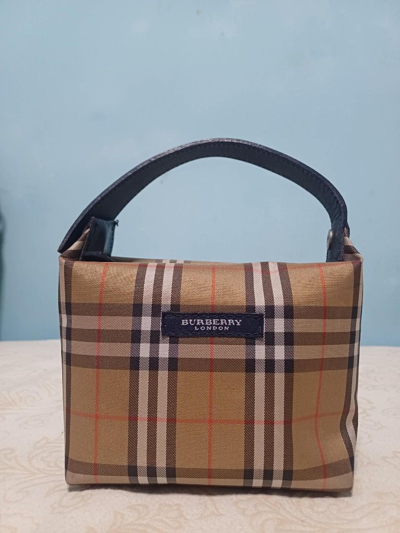 Burberry London Nova Check Canvas Mini Handbag (Category: Luxury Bags & Wallets) located in Naga. Submitted by mrwisethrifter (Listing ID 1459400751, Image 2). Description: - Classic Burberry London mini handbag - Iconic Nova Check pattern - Small and compact, ideal for essentials - Black leather handle - Timeless and versatile piece - Perfect for quick outings.