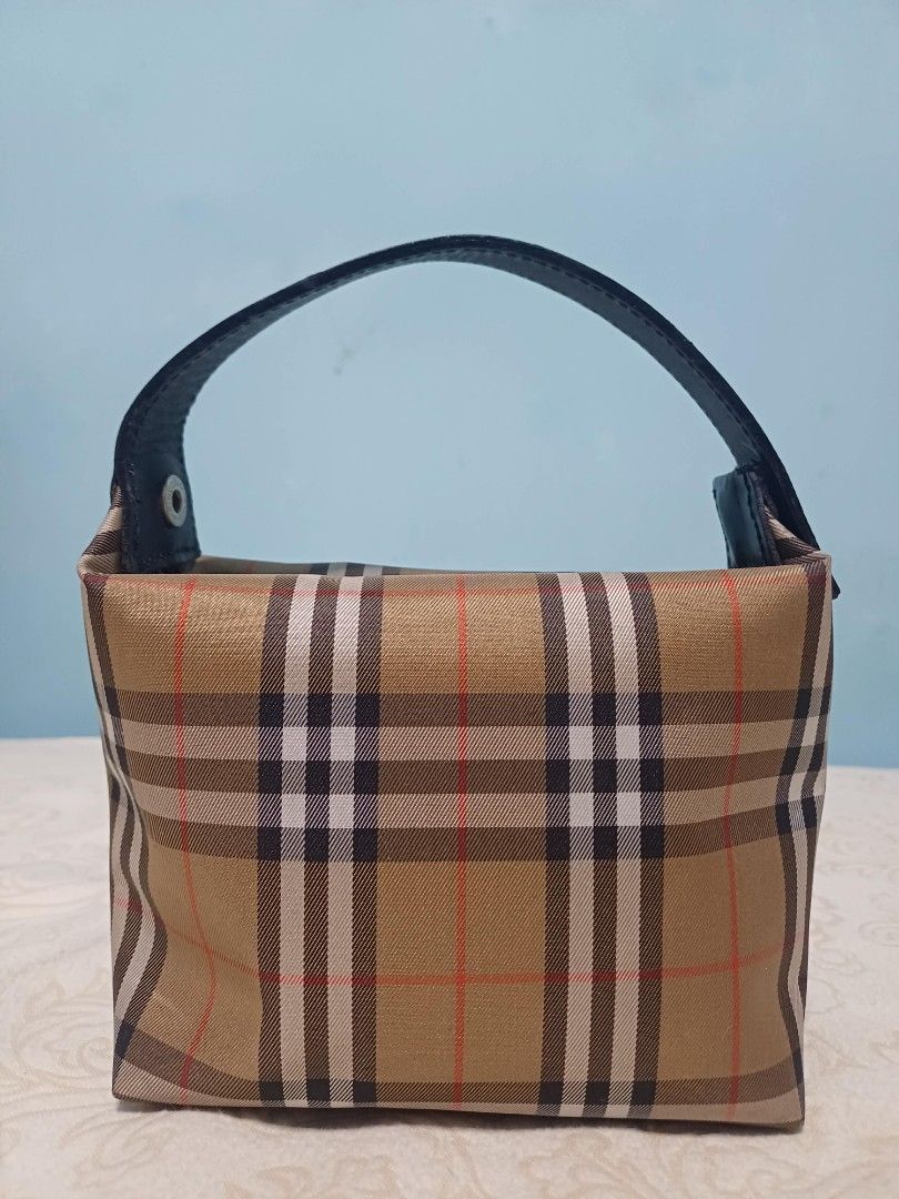 Burberry London Nova Check Canvas Mini Handbag (Category: Luxury Bags & Wallets) located in Naga. Submitted by mrwisethrifter (Listing ID 1459400751, Image 3). Description: - Classic Burberry London mini handbag - Iconic Nova Check pattern - Small and compact, ideal for essentials - Black leather handle - Timeless and versatile piece - Perfect for quick outings.