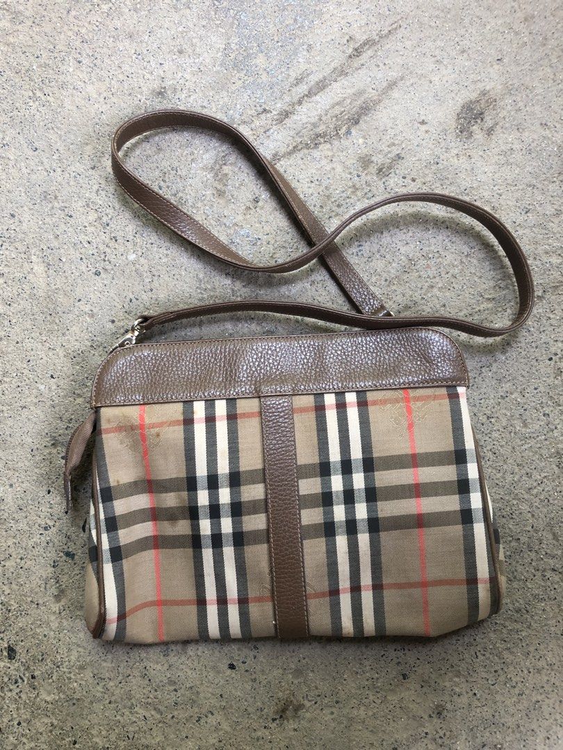 Burberry Nova Check Leather Crossbody Bag (Category: Luxury Bags & Wallets) located in Montevista. Submitted by rdthriftshub (Listing ID 1459336114, Image 2). Description: - Classic Burberry crossbody bag - Iconic Nova Check pattern - Brown leather trim and strap - Zipper closure - Leather strap is intact - Great for everyday essentials Issue:yellow stain Sign of wear,nasa post napo lahat ng details .