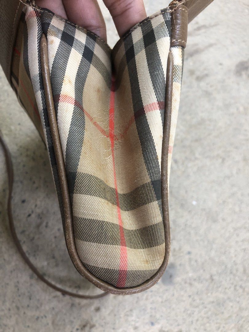 Burberry Nova Check Leather Crossbody Bag (Category: Luxury Bags & Wallets) located in Montevista. Submitted by rdthriftshub (Listing ID 1459336114, Image 3). Description: - Classic Burberry crossbody bag - Iconic Nova Check pattern - Brown leather trim and strap - Zipper closure - Leather strap is intact - Great for everyday essentials Issue:yellow stain Sign of wear,nasa post napo lahat ng details .