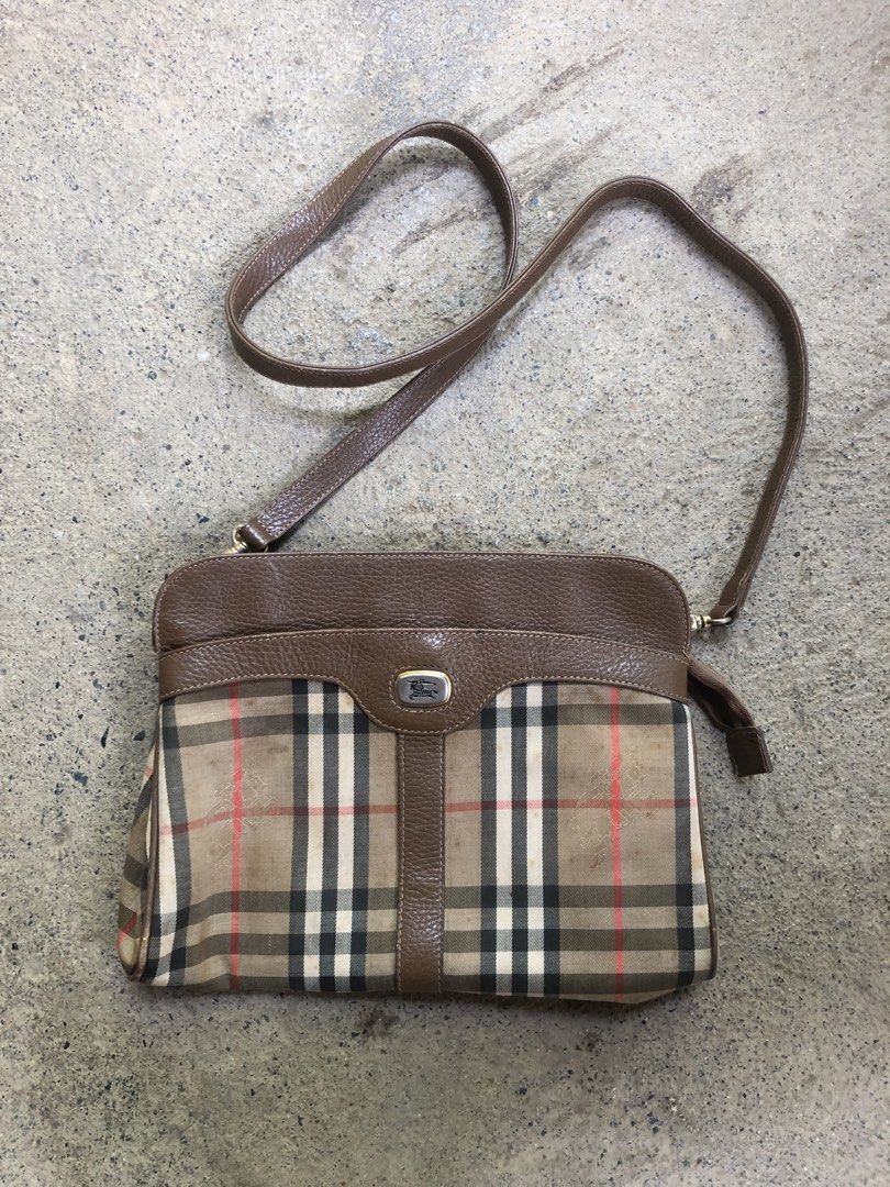 Burberry Nova Check Leather Crossbody Bag (Category: Luxury Bags & Wallets) located in Montevista. Submitted by rdthriftshub (Listing ID 1459336114, Image 1). Description: - Classic Burberry crossbody bag - Iconic Nova Check pattern - Brown leather trim and strap - Zipper closure - Leather strap is intact - Great for everyday essentials Issue:yellow stain Sign of wear,nasa post napo lahat ng details .
