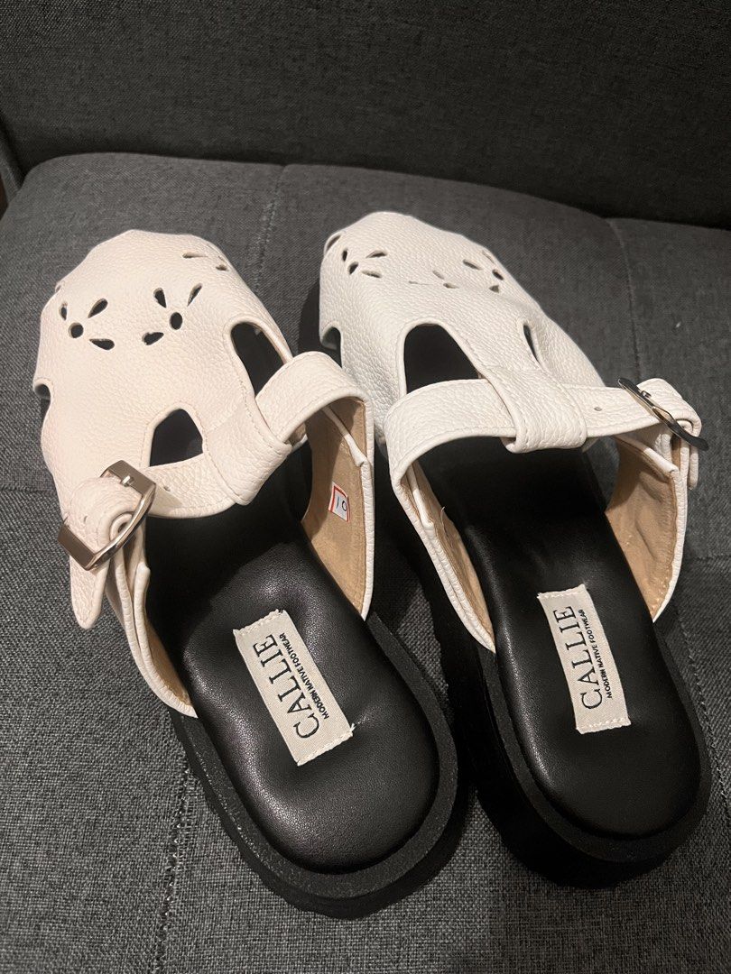 CALLIE White Leather Cut-out Platform Sandals (Category: Flats & Sandals) located in Cainta. Submitted by ohitscolleen (Listing ID 1459397043, Image 3). Description: - Brand: CALLIE - Material: White Leather - Design: Unique front cut-out - Closure: Adjustable strap with buckle - Sole: Comfortable platform sole - Style: Easy slip-on - Occasion: Ideal for casual outings.