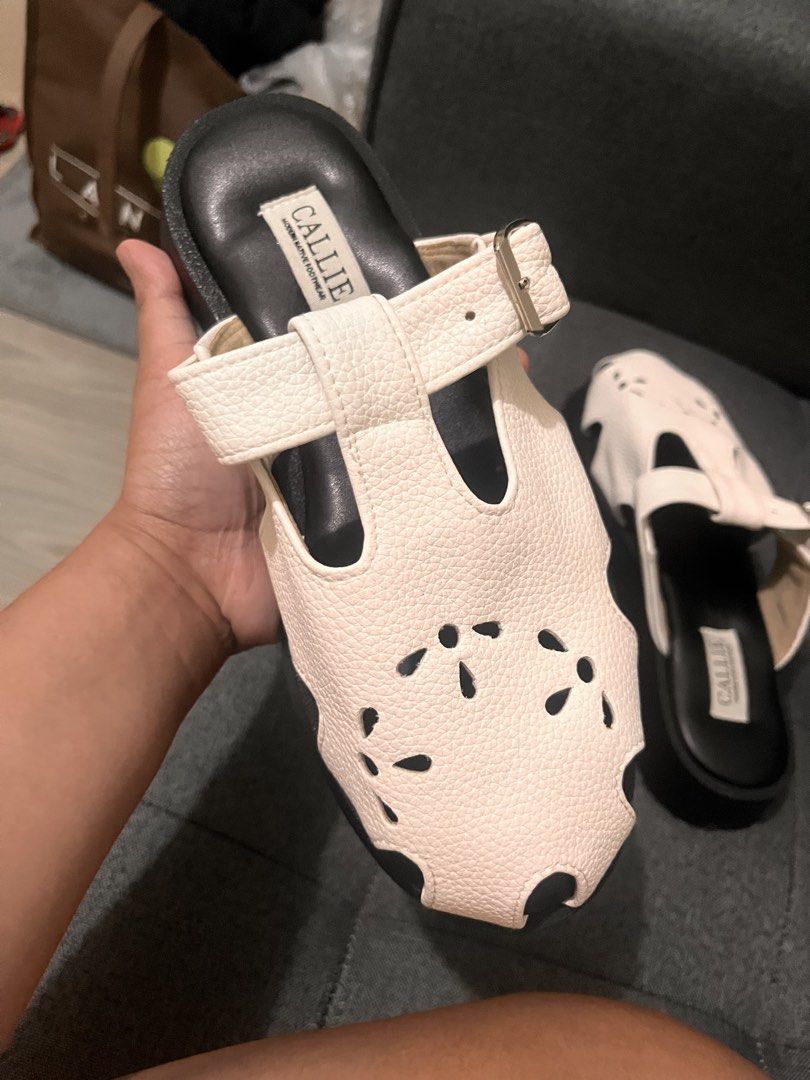 CALLIE White Leather Cut-out Platform Sandals (Category: Flats & Sandals) located in Cainta. Submitted by ohitscolleen (Listing ID 1459397043, Image 2). Description: - Brand: CALLIE - Material: White Leather - Design: Unique front cut-out - Closure: Adjustable strap with buckle - Sole: Comfortable platform sole - Style: Easy slip-on - Occasion: Ideal for casual outings.