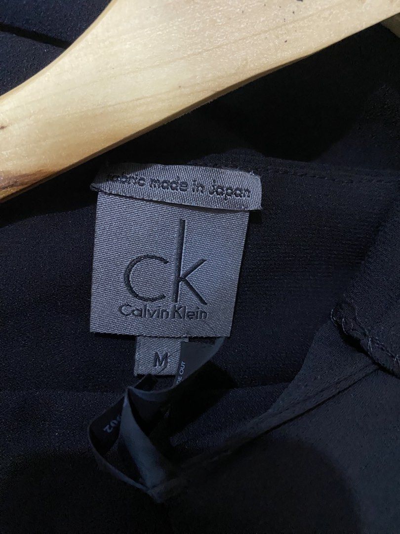 Calvin Klein Black Pleated Puff Sleeve Top Size M (Category: Blouses) located in Angeles City. Submitted by calmrabbit.ae2127 (Listing ID 1459315621, Image 3). Description: - Black Calvin Klein top - Size: Medium (M) - Short puff sleeves - Pleated detail on the front - Fabric made in Japan - Perfect for dressing up or down.
