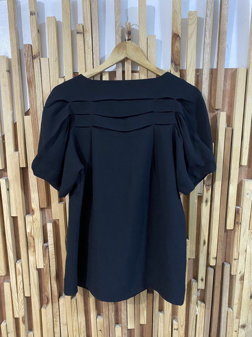 Calvin Klein Black Pleated Puff Sleeve Top Size M (Category: Blouses) located in Angeles City. Submitted by calmrabbit.ae2127 (Listing ID 1459315621, Image 2). Description: - Black Calvin Klein top - Size: Medium (M) - Short puff sleeves - Pleated detail on the front - Fabric made in Japan - Perfect for dressing up or down.