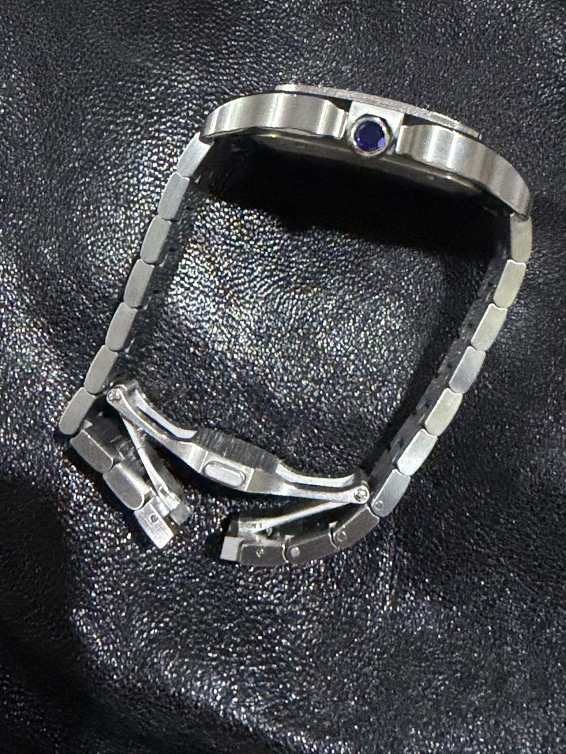 Cartier Santos large (Category: Luxury Watches) located in Mandaluyong City. Submitted by gusteng (Listing ID 1459443641, Image 3). Description: 20 links Box Case Width: 39.8 mmThickness: 9.38 mmLug-to-Lug: Approx. 47.5 mmMaterial: Stainless steel (with variations available in two-tone or ADLC/carbon bezel finishes)Crown: 7-sided crown set with a faceted synthetic spinelWater Resistance: Up to 10 bar (100 meters / 328 feet)Movement and FeaturesCa