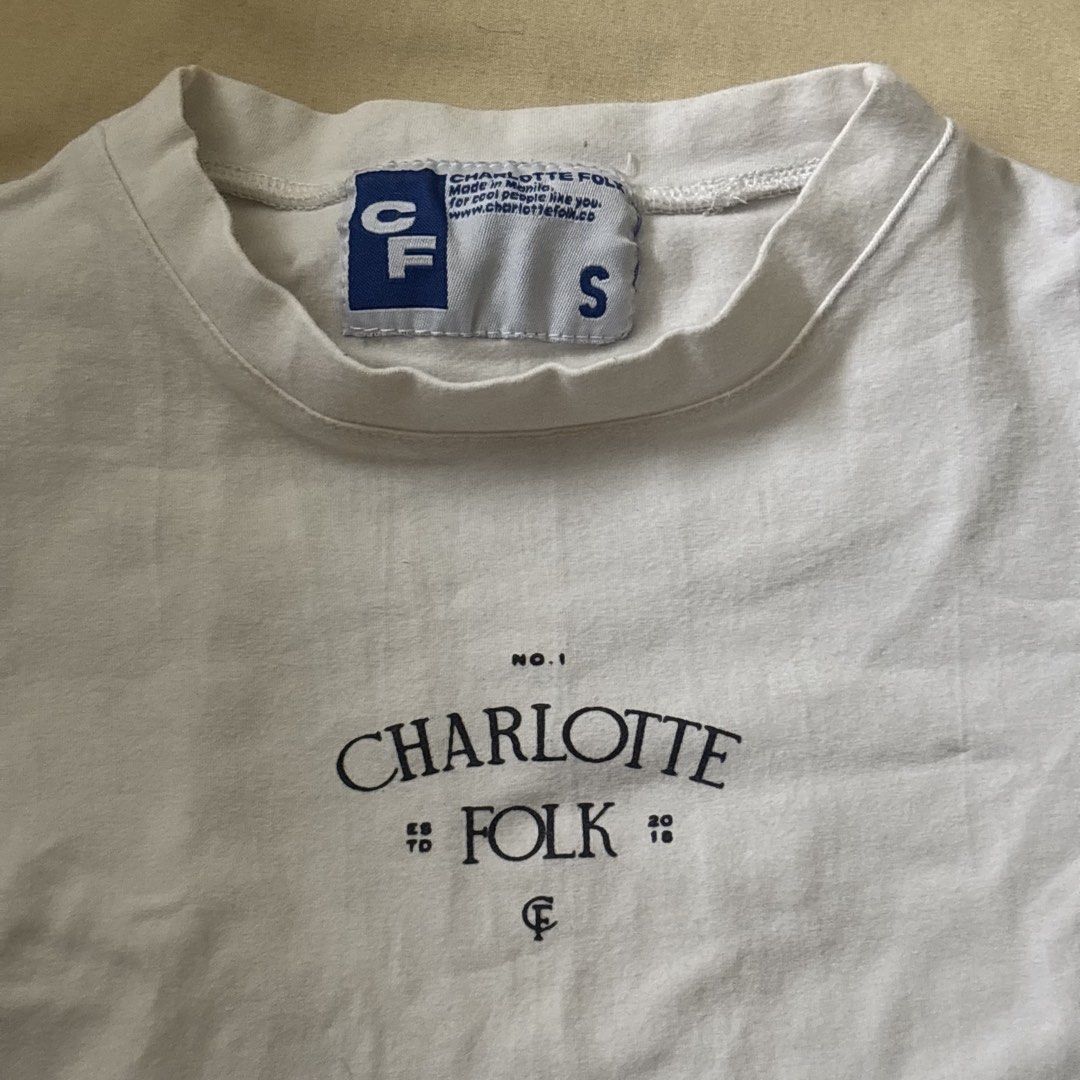 Charlotte Folk White Crop Top (Category: Shirts) located in Quezon City. Submitted by goodstuffph (Listing ID 1459351008, Image 2). Description: - Brand: Charlotte Folk - Color: White - Style: Cropped T-shirt - Size: S - No flaws .