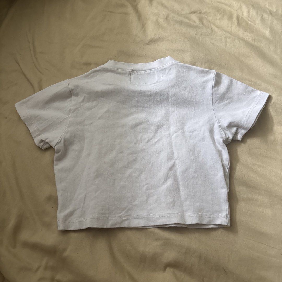 Charlotte Folk White Crop Top (Category: Shirts) located in Quezon City. Submitted by goodstuffph (Listing ID 1459351008, Image 3). Description: - Brand: Charlotte Folk - Color: White - Style: Cropped T-shirt - Size: S - No flaws .