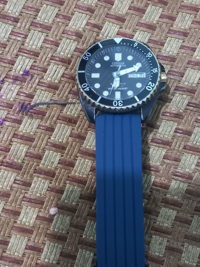 Citizen Automatic Dive Watch Blue Rubber Strap (Category: Men's Watches) located in Subic. Submitted by regiegabriel29 (Listing ID 1459383739, Image 2). Description: - Citizen Automatic 200m Watch - Blue Rubber Strap - Water Resistant - Day and Date Display - Rotating Bezel - Ideal for everyday wear or diving - Watch is functional and keeps time - Major signs of wear on bezel and case.