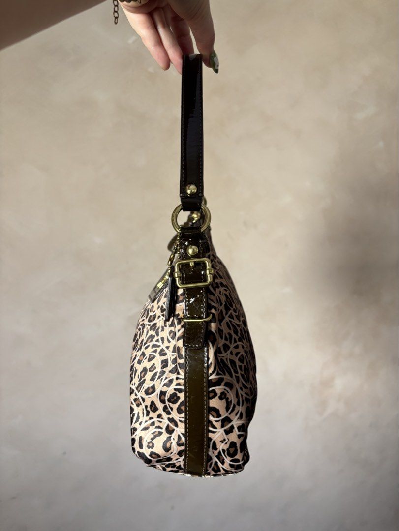 Coach Madison Leopard Ocelot (Category: Luxury Bags & Wallets) located in Calamba. Submitted by chrysanthemums.mnl (Listing ID 1459307374, Image 3). Description: Small size, not mini but small. Same width with the mini, just a little longer in length. Firm price. Scammers and photo grabbers don't attempt to text me. I won't send additional photos without receiving the payment 😊.