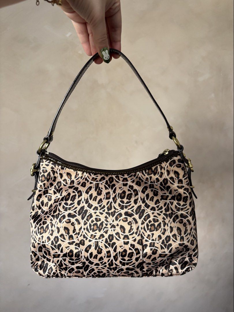 Coach Madison Leopard Ocelot (Category: Luxury Bags & Wallets) located in Calamba. Submitted by chrysanthemums.mnl (Listing ID 1459307374, Image 2). Description: Small size, not mini but small. Same width with the mini, just a little longer in length. Firm price. Scammers and photo grabbers don't attempt to text me. I won't send additional photos without receiving the payment 😊.