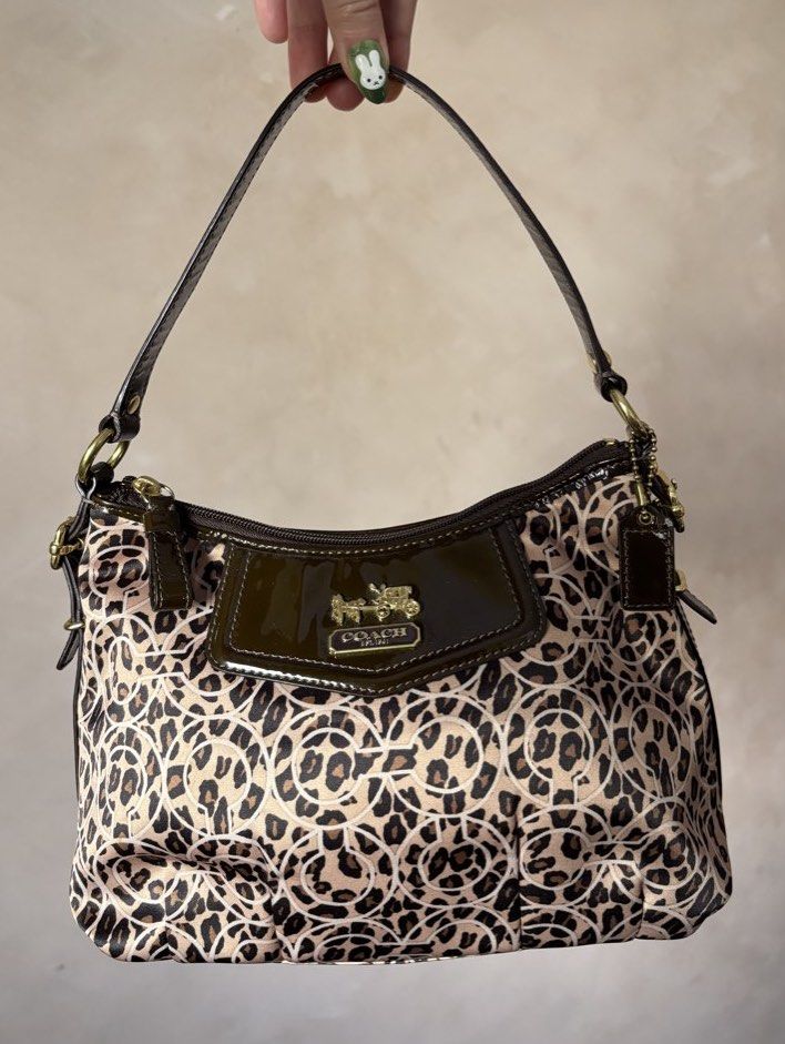 Coach Madison Leopard Ocelot (Category: Luxury Bags & Wallets) located in Calamba. Submitted by chrysanthemums.mnl (Listing ID 1459307374, Image 1). Description: Small size, not mini but small. Same width with the mini, just a little longer in length. Firm price. Scammers and photo grabbers don't attempt to text me. I won't send additional photos without receiving the payment 😊.