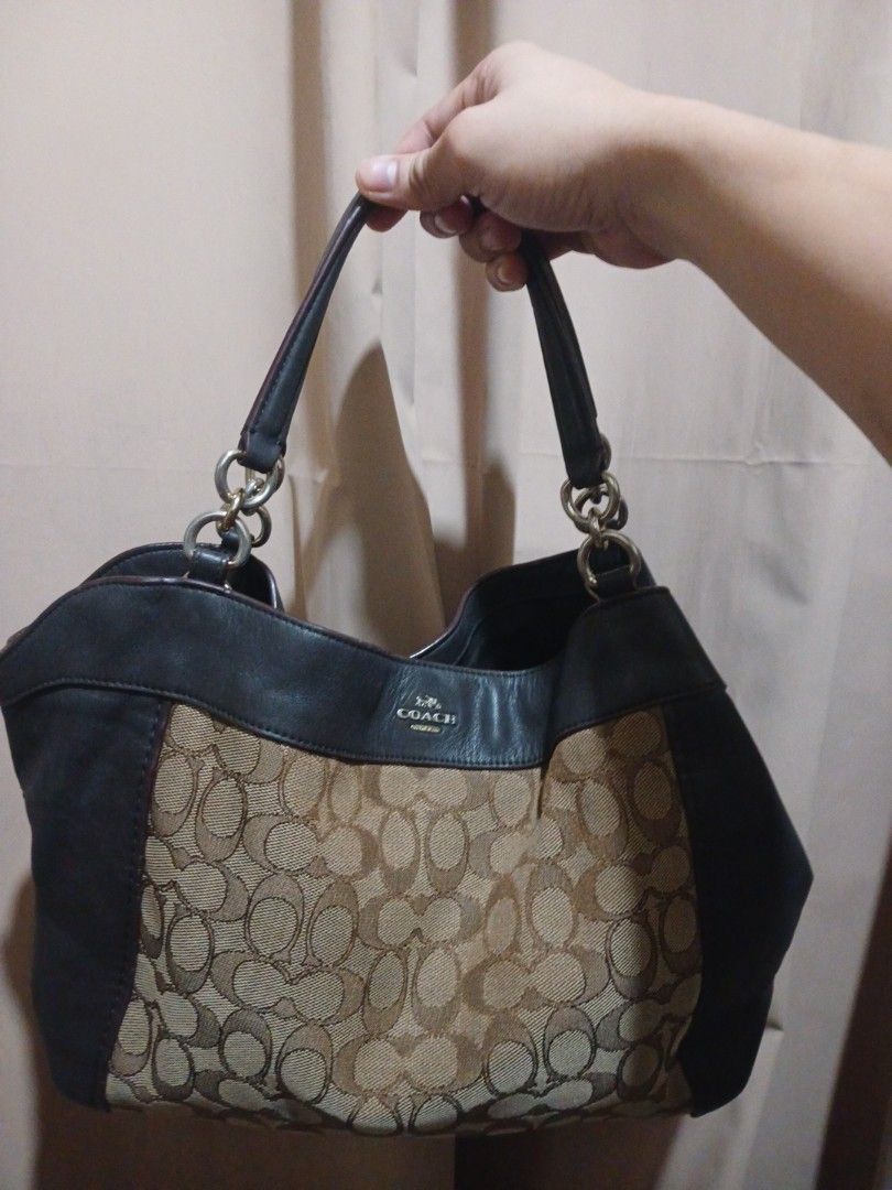 Coach Monogram Canvas Leather Hobo Shoulder Bag (Category: Luxury Bags & Wallets) located in Manila. Submitted by acezenergy (Listing ID 1459407106, Image 1). Description: - Authentic Coach hobo bag - Signature C monogram canvas - Black leather trim - Silver hardware - Comfortable shoulder straps - Spacious interior - Ideal for everyday use.
