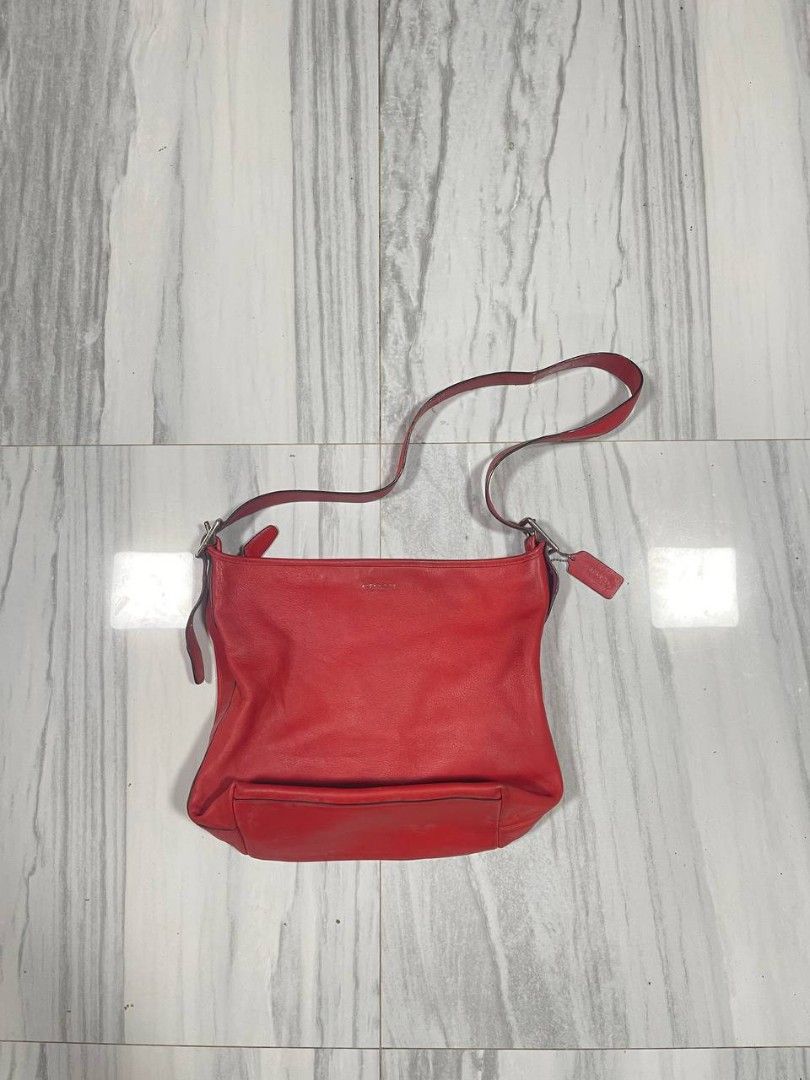 Coach Red legacu duffle Bag (Category: Luxury Bags & Wallets) located in Panabo. Submitted by t-thrifts (Listing ID 1459351929, Image 1). Description: - Authentic Coach red leather duffle bag - Main compartment for your essentials - Convenient zippered pocket on the back - Adjustable strap for comfortable wear - Comes with original Coach leather tag - Ideal size for everyday use.