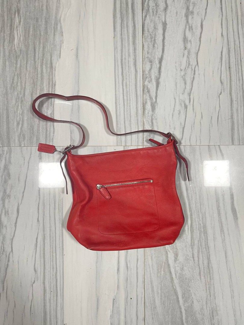 Coach Red legacu duffle Bag (Category: Luxury Bags & Wallets) located in Panabo. Submitted by t-thrifts (Listing ID 1459351929, Image 2). Description: - Authentic Coach red leather duffle bag - Main compartment for your essentials - Convenient zippered pocket on the back - Adjustable strap for comfortable wear - Comes with original Coach leather tag - Ideal size for everyday use.