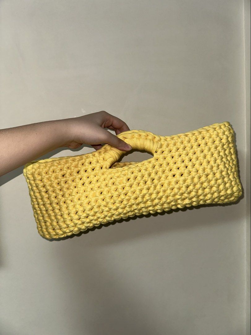 East-West Handbag Crochet (handmade) (Category: Purses & Pouches) located in San Juan City. Submitted by channiesara3 (Listing ID 1459451386, Image 3). Description: Handmade crocheted hand bag made by instag: @niks_knackshop Inspired by LOOSENDS crochet - Material: T-shirt yarn (smooth and stretchy material) - Color: Yellow - Size: (37-38cm length x 15-16cm height x 8-10cm width) - spacious - open style / no lock - feel free to inquire for more d