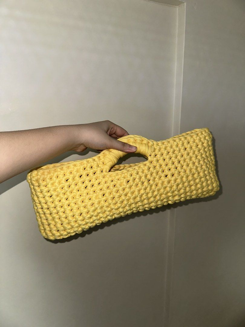 East-West Handbag Crochet (handmade) (Category: Purses & Pouches) located in San Juan City. Submitted by channiesara3 (Listing ID 1459451386, Image 2). Description: Handmade crocheted hand bag made by instag: @niks_knackshop Inspired by LOOSENDS crochet - Material: T-shirt yarn (smooth and stretchy material) - Color: Yellow - Size: (37-38cm length x 15-16cm height x 8-10cm width) - spacious - open style / no lock - feel free to inquire for more d