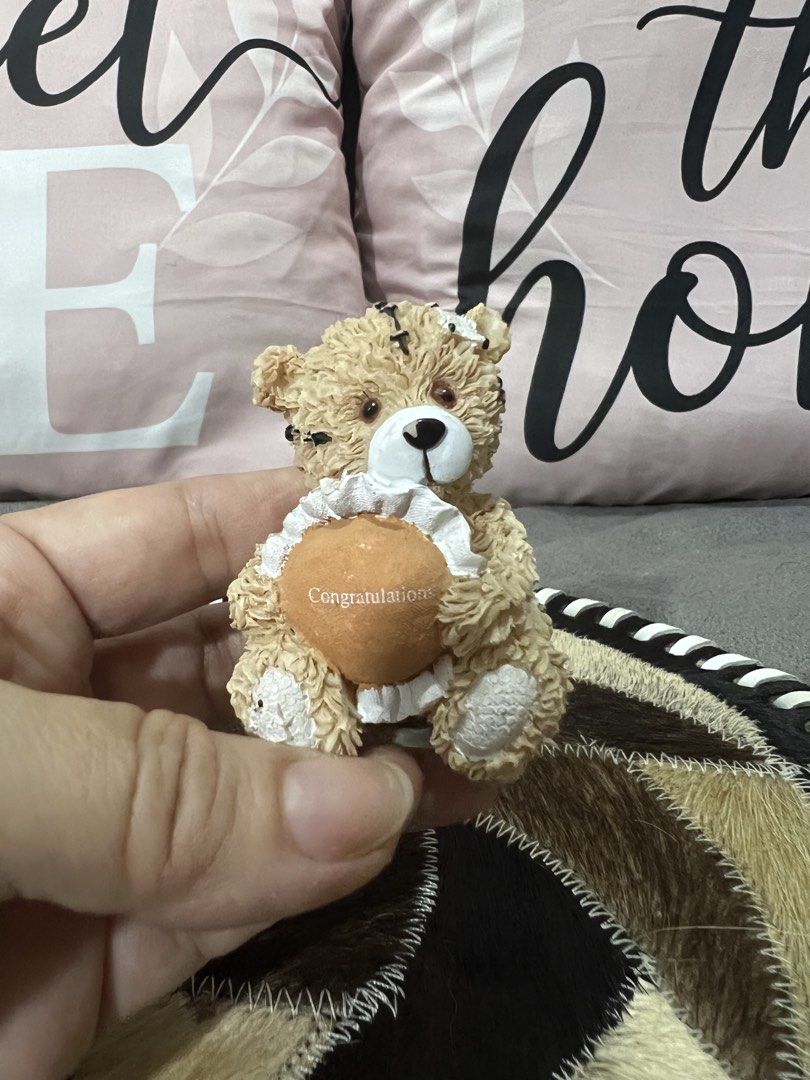 Cute Bear Figurine Holding 'Congratulations' Heart (Category: Designer & Blind Box Toys) located in Las Pinas. Submitted by maple0305 (Listing ID 1459464104, Image 2). Description: - Adorable bear figurine - Holding a heart with 'Congratulations' message - Ideal for gifting or desk decoration - Well-detailed craftsmanship - Celebrates any achievement.