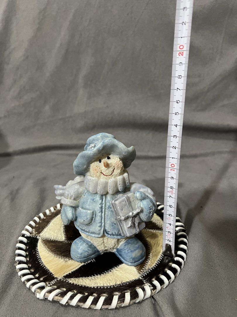 Cute Blue Snowman Figurine with Gift (Category: Other Home Decor) located in Las Pinas. Submitted by maple0305 (Listing ID 1459425443, Image 3). Description: - Adorable blue snowman figurine - Dressed in a hat, coat, and scarf - Holding a small gift box - Measures approximately 5 inches tall - Ideal for holiday and winter decor - Adds a festive touch to shelves and tables.