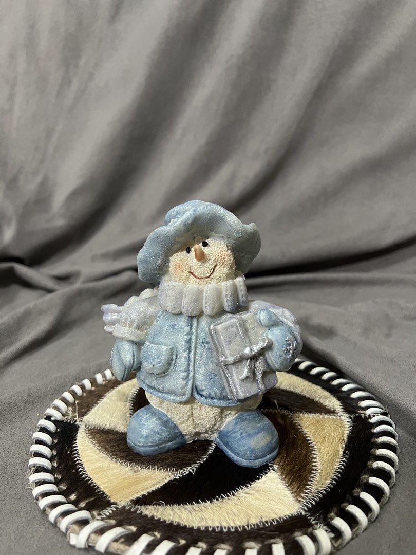 Cute Blue Snowman Figurine with Gift (Category: Other Home Decor) located in Las Pinas. Submitted by maple0305 (Listing ID 1459425443, Image 1). Description: - Adorable blue snowman figurine - Dressed in a hat, coat, and scarf - Holding a small gift box - Measures approximately 5 inches tall - Ideal for holiday and winter decor - Adds a festive touch to shelves and tables.